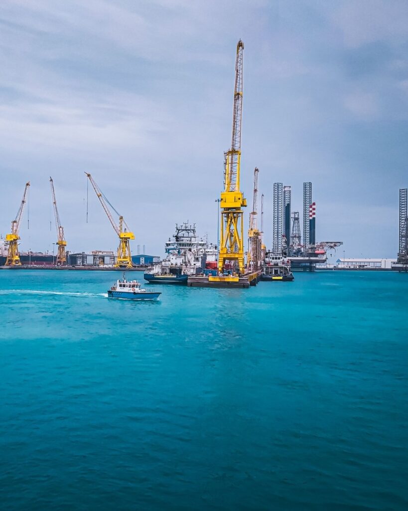 Home Offshore yard with cranes, vessels and jack-up rigs